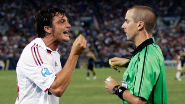 AC Milan's Massimo Oddo (L) argues with referee Mark Geiger after receiving a yellow card for fouling Chelsea's Ashley Cole. (File: Reuters)