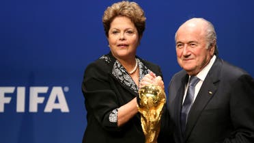 Brazil’s President Dilma Rousseff (L) poses with FIFA President Sepp Blatter after delivering a statement at the FIFA headquarters in Zurich January 23, 2014.(AFP)