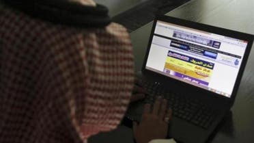 A Saudi man explores a website on his laptop in Riyadh in this file photo taken on February 11, 2014.  (Reuters)