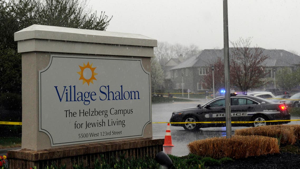 A police car blocks the scene of a shooting at Village Shalom, an assisted living center, as rain falls in Overland Park, Kansas April 13, 2014. (Reuters)