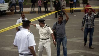 Cairo bomb wounds two policemen, civilian