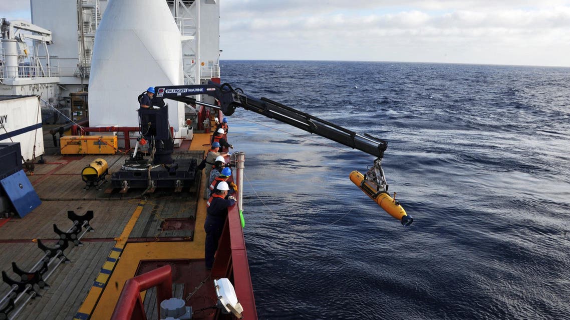 This handout image from the U.S. Navy shows operators aboard ADF Ocean Shield moving U.S. Navy’s Bluefin-21 into position for deployment in the search of missing Malaysia Airlines flight MH370. (AFP)