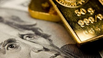 Gold slips as dollar bounces back from U.S. data hit