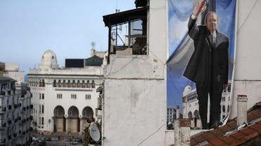 A poster showing Algerian President and candidate to the presidential elections Abdelaziz Bouteflika hangs on a building in the center of the capital Algiers on April 17, 2014. (AFP)