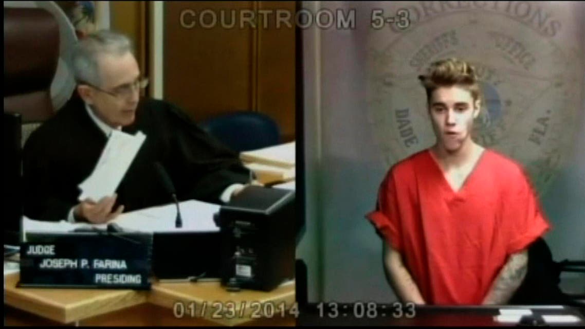 Pop singer Justin Bieber appears in front of Judge Joseph Farina by video link in this still image from video from Miami, Florida January 23, 2014. reuters