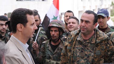 Syrian President Bashar al-Assad (L) talks to soldiers during his visit to Maaloula town, northeast of Damascus April 20, 2014. (Reuters)