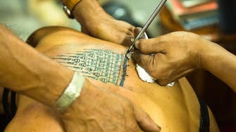 Sri Lanka detains British tourist over Buddha tattoo 