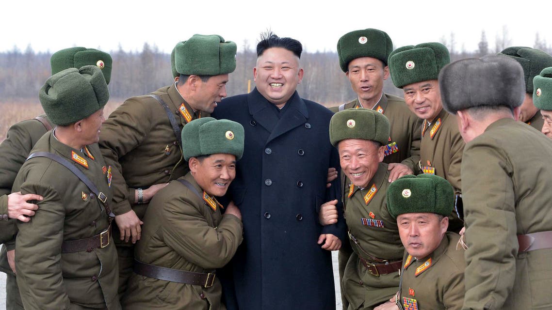 North Korean leader Kim Jong Un (C) smiles as he stands with commanding officers of the combined units of the Korean People's Army reuters