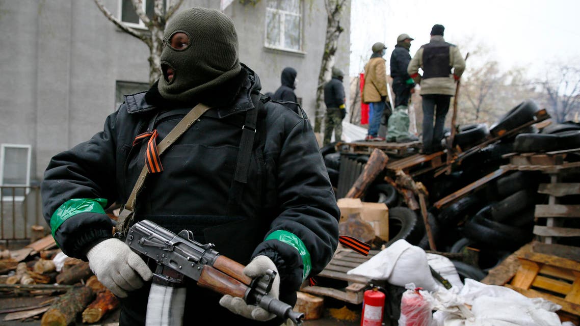 armed pro-russia man reuters