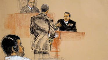 In this sketch approved by the military by court artist Janet Hamlin Abd Al Rahim Muhammad al-Nashiri (L) watches courtroom proceedings. (Reuters) 