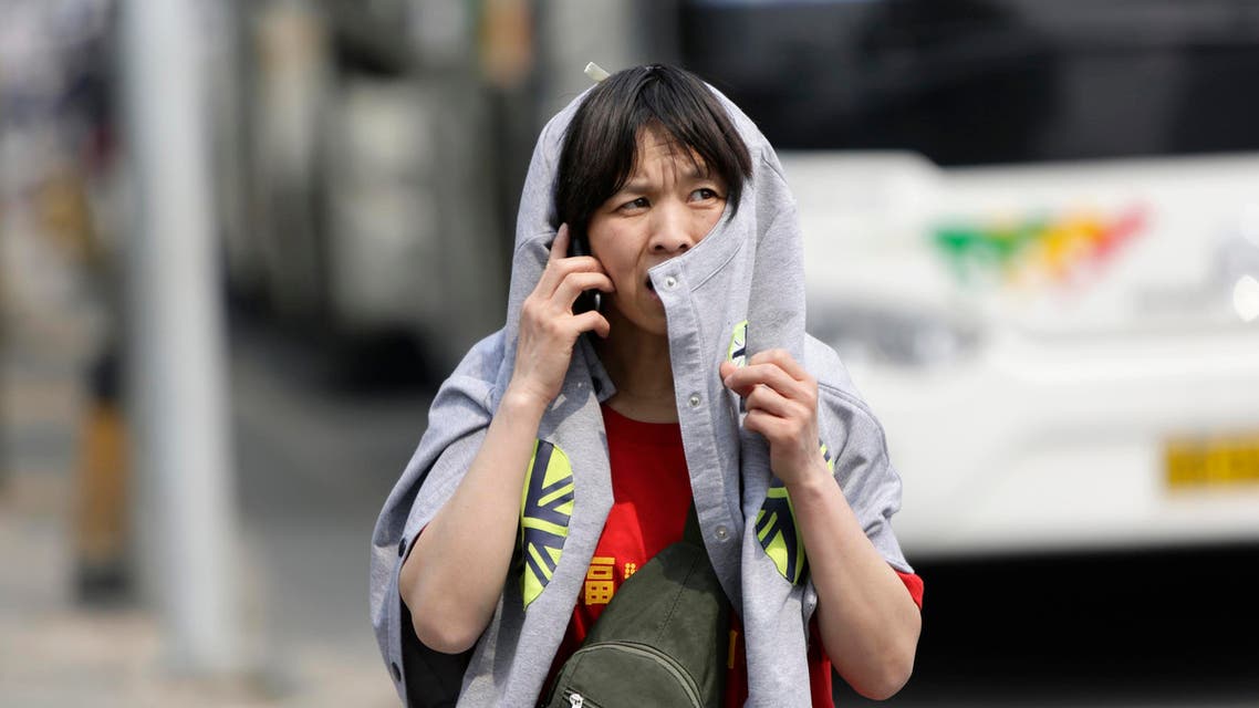 A family member of passengers aboard the missing Malaysia Airlines flight MH370 is seen on her way to the Malaysia Embassy in Beijing April 25, 2014. (Reuters)