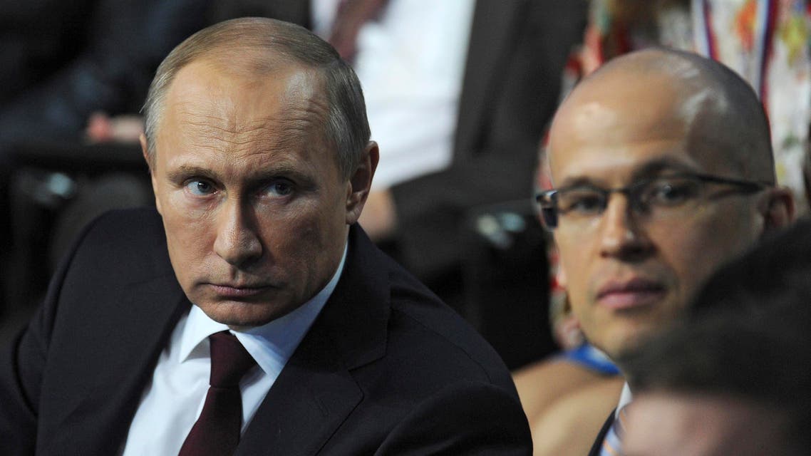 Russia's President Vladimir Putin (L) attends a televised meeting with regional media in St. Petersburg, April 24, 2014. (Reuters)