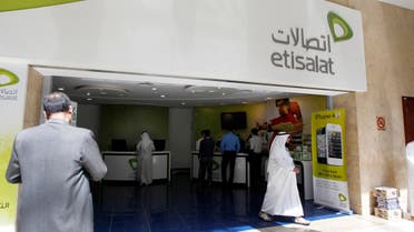 A customer walks out of an Etisalat shop at the Dubai World Trade Centre in Dubai. Reuters 