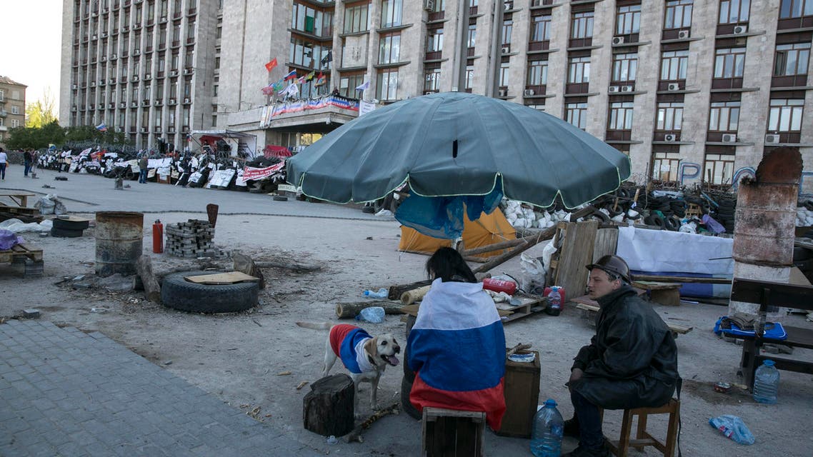 Pro-Russian activists sit outside a regional government building in Donetsk, eastern Ukraine April 24, 2014. (Reuters)