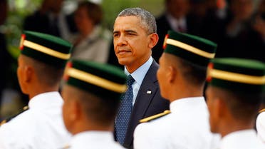 U.S. President Barack Obama inspects an honour guard during a state welcoming ceremony outside the Parliament house in Kuala Lumpur April 26, 2014 reuters