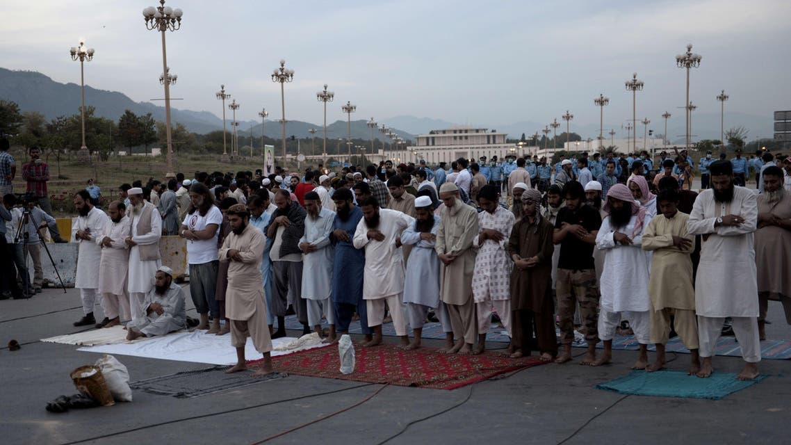 Families members of missing Pakistani offer prayers during a protest against the disappearance of their relatives allegedly caused by the country's security forces in Islamabad on April 28, 2014. (AFP)