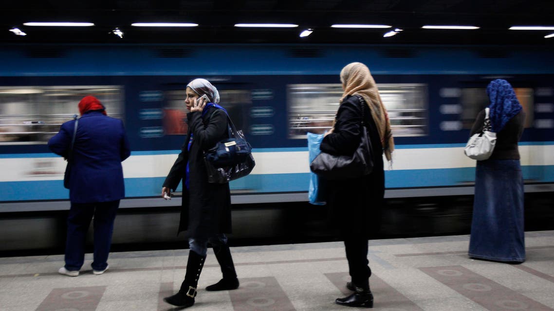 A woman speaks on the phone at a metro station in Cairo. (Reuters)