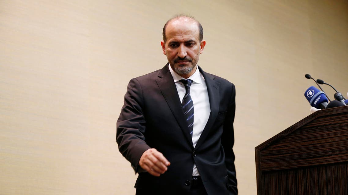 Syrian opposition leader Ahmed Jarba leaves a news conference in Geneva January 23, 2014.