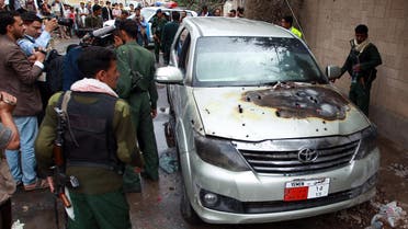 Yemeni soldiers and reporters inspect a bullet riddled car which was used by staff from the French embassy after it was attacked by gunmen on May 5, 2014 in Sanaa's diplomatic district of Hada. (AFP)