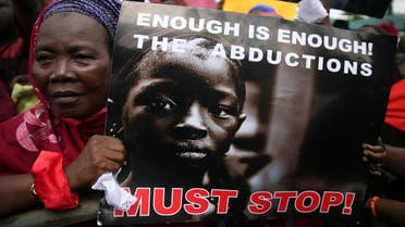 A woman holds a sign during a protest demanding the release of abducted secondary school girls from the remote village of Chibok, in Lagos May 5, 2014. (AFP)