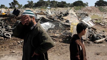 A Palestinian man reacts after his shanty, which Israel said was built illegally, was demolished by Israel's civil administration at a Bedouin encampment near Jerusalem April 3, 2014.  (Reuters)