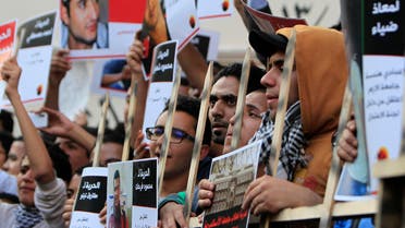 Members of the April 6 movement shout slogans with activists against the government as they protest against the detention of several members of their movement in Cairo, April 6, 2014. (Reuters) 