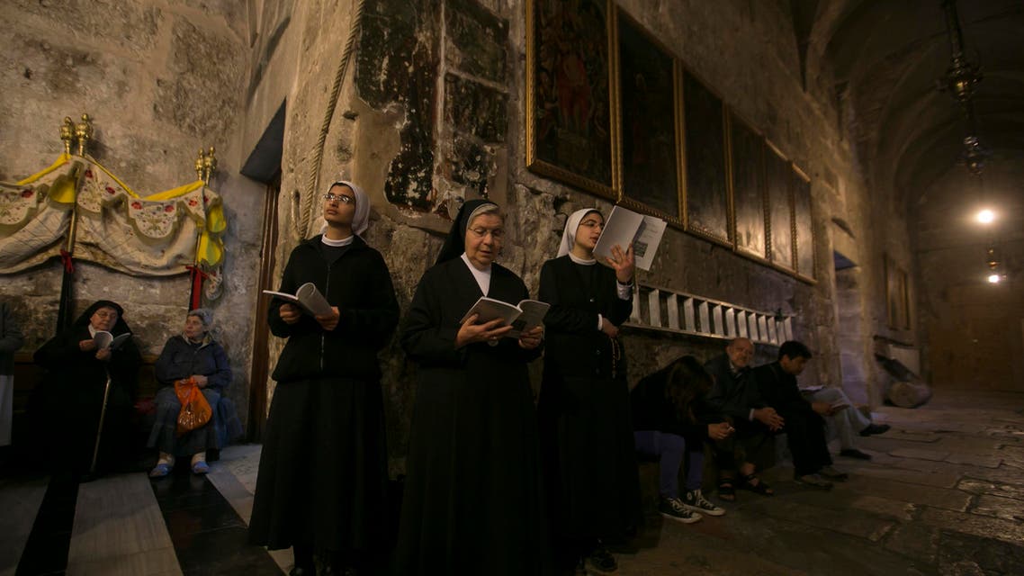 Nuns pray during the Catholic Washing of the Feet ceremony inside the Church of the Holy Sepulchre in Jerusalem's Old City April 17, 2014. (Reuters)