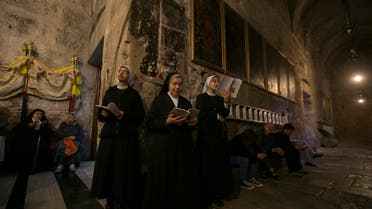 Nuns pray during the Catholic Washing of the Feet ceremony inside the Church of the Holy Sepulchre in Jerusalem's Old City April 17, 2014. (Reuters)