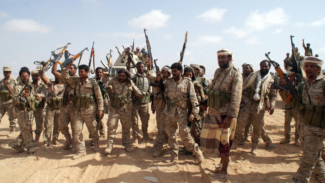 Yemeni soldiers brandish their weapons as they take part in an offensive against extremists in the southern province of Shabwa, on May 7, 2014. (AFP)