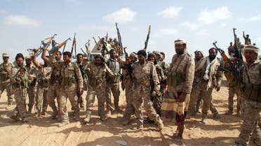 Yemeni soldiers brandish their weapons as they take part in an offensive against extremists in the southern province of Shabwa, on May 7, 2014. (AFP)
