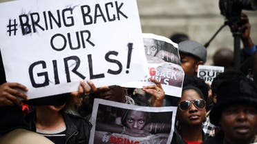 Protestors hold placards as they demonstrate outside Nigeria House in central London on May 9, 2014, to demand the return of more than 200 Nigerian schoolgirls abducted by the Boko Haram Islamist group. AFP