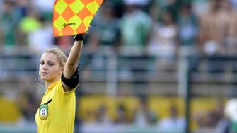 The beautiful game: Female Brazilian football ref becomes web sensation 
