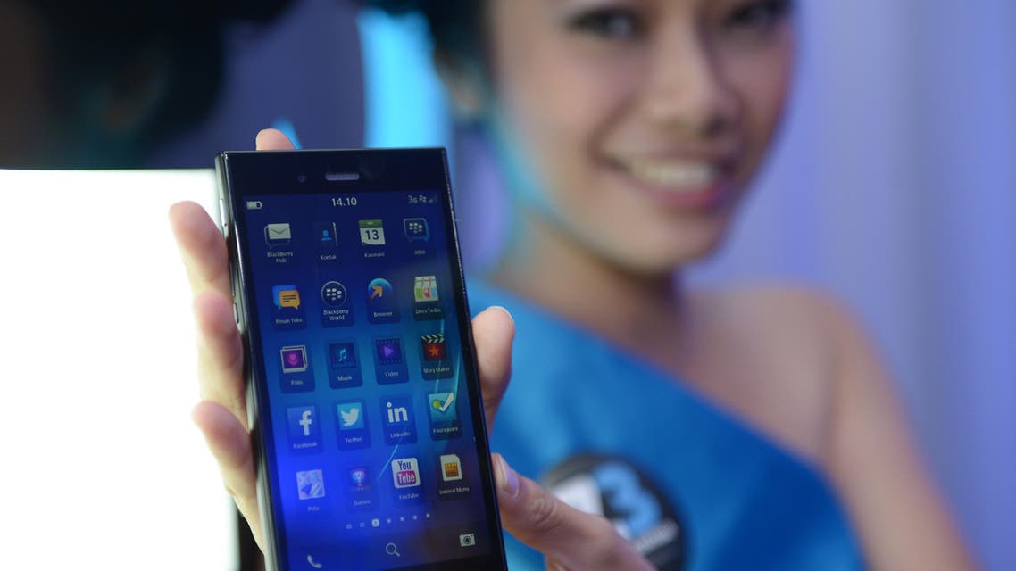 A model shows a BlackBerry Z3 ‘Jakarta edition’ smartphone during a ceremony in Indonesia. (AFP)