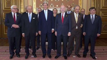 Foreign ministers from the Friends of Syria group - including U.S. Secretary of State John Kerry (C-R) and UK Foreign Secretary William Hague (C-L)  - pose after meeting in London on May 15, 2014.  (AFP)