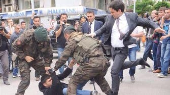 Turkey angered as Erdogan’s aide kicks protester