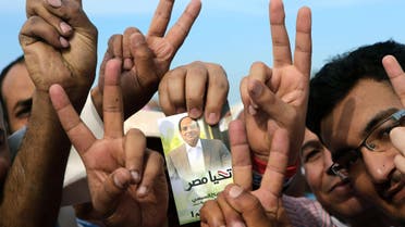 Egyptian expatriates living in Kuwait hold an image of Egypt's ex-army chief and presidential candidate Abdel Fattah al-Sisi, afp 