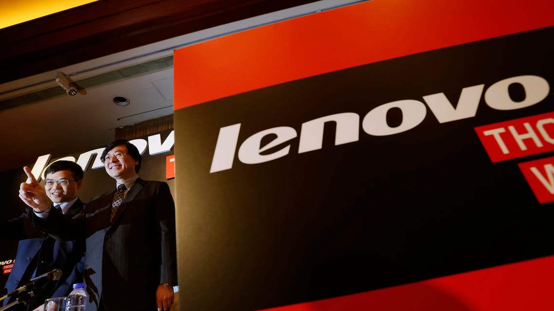 Lenovo Chairman and Chief Executive Officer Yang Yuanqing (R) gestures beside Chief Financial Officer Wong Wai-ming during a news conference announcing the company's annual results in Hong Kong May 21, 2014. reuters