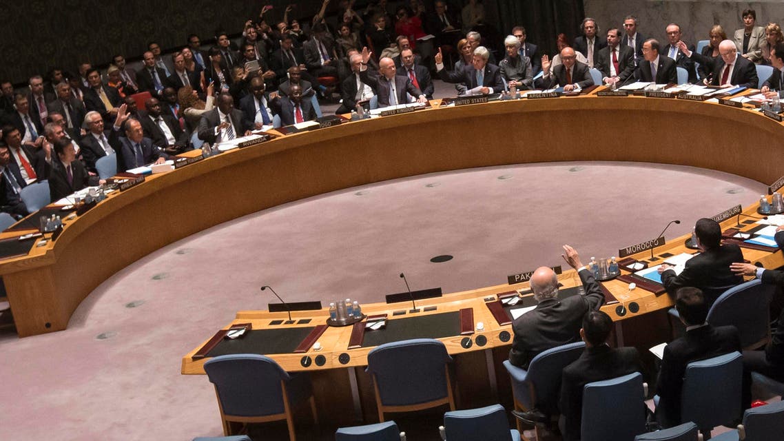 Members of the United Nations Security Council raise their hands as they vote unanimously to approve a resolution eradicating Syria's chemical arsenal at a Security Council meeting during the 68th United Nations General Assembly in New York on September 27, 2013. REUTERS