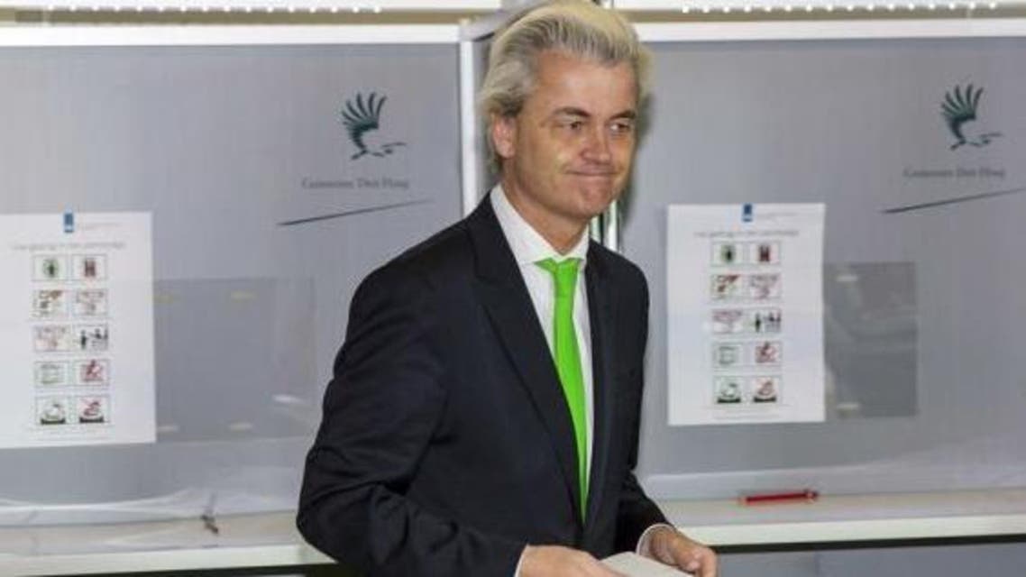 ar-right politician Geert Wilders of the anti-immigration Dutch Freedom (PVV) Party casts his vote during the European Parliament elections, in an elementary school in the Hague May 22, 2014.