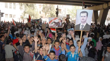 Children attend a rally in support of Syria's President Bashar al-Assad and the army at al-Zahera neighbourhood in Damascus April 7, 2014, in this handout photograph released by Syria's national news agency SANA .  Reuters