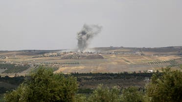 Smoke rises from Kvrbasin, in what activists say was shelling by forces loyal to the Syrian regime after Free Syrian Army fighters claim they took control of the village, Idlib countryside May 24, 2014. (Reuters)