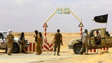 Rebels under Libyan rebel leader Ibrahim Jathran guard the entrance of the al-Ghani oil field, which is currently under the group's control, south of Ras Lanuf March 18, 2014. (Reuters)