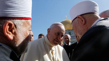 Pope Francis (C) stands next to Sheikh Mohammad Hussein (L), the Grand Mufti of Jerusalem as the Dome of the Rock is seen in the background reuters