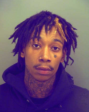 This booking photo provided by the El Paso Police Department shows Cameron Thomaz, better known as, Wiz Khalifa in El Paso, Texas, Sunday May 25, 2014.