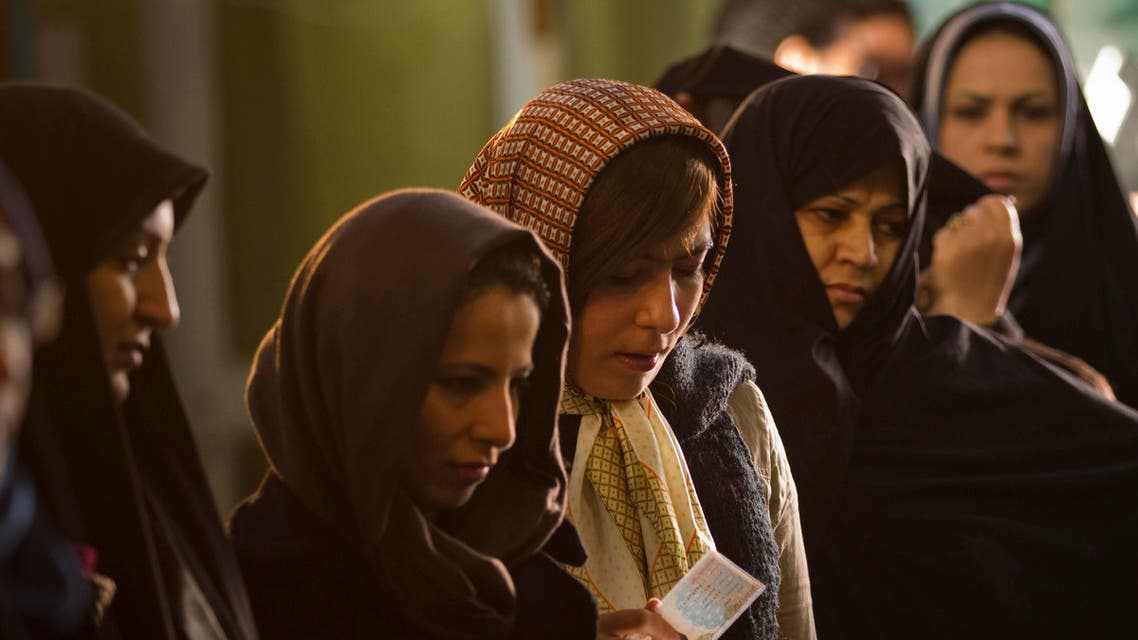 Women wait in line to vote for the parliamentary election in a mosque in south Tehran March 2, 2012. (Reuters)