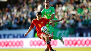 Armenia's Aleksandr Tumasyan (L) fights for the ball with Algeria's Nabil Bentaleb during their international friendly soccer match at the Tourbillon stadium in Sion May 31, 2014. (Reuters)