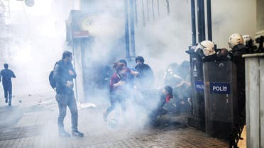 Turkish riot police use tear gas to disperse protesters gathered on the central Istoklal avenue near Taksim square in Istanbul, on May 31, 2014. (AFP)