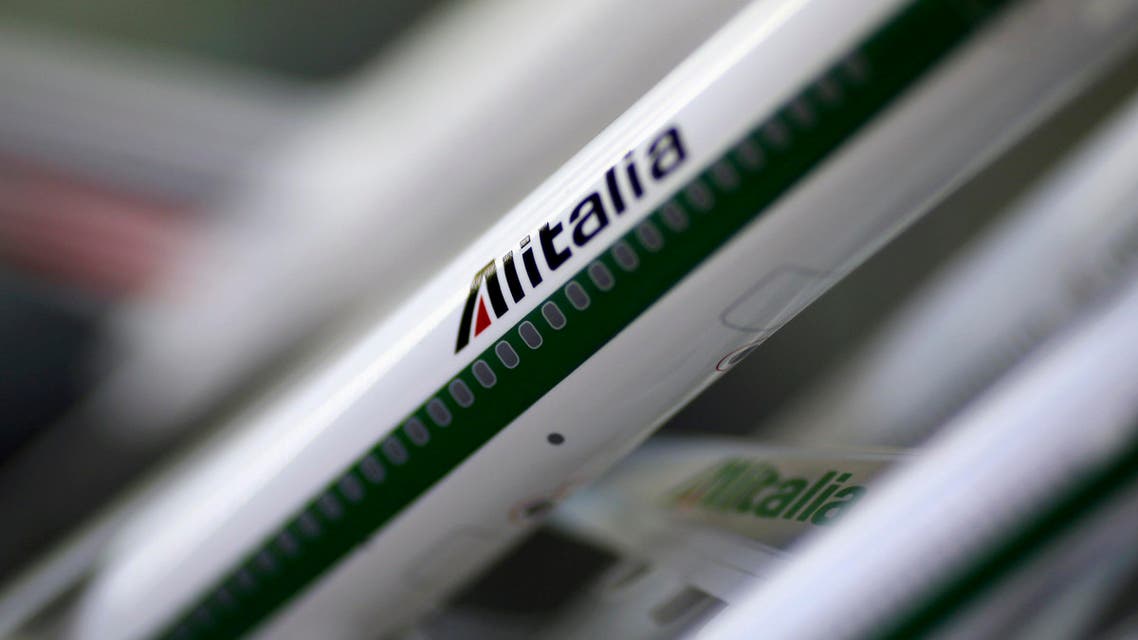 Scale models of Alitalia airplanes are displayed at a shop selling models of vehicles in Rome October 31, 2013. (Reuters)