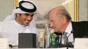 FIFA President Sepp Blatter (R) speaks with Qatar's 2022 World Cup bid Chief Sheikh Mohammed Al-Thani at a news conference in Doha November 9, 2013. (Reuters)