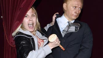 Femen activist strikes the heart of Putin’s statue